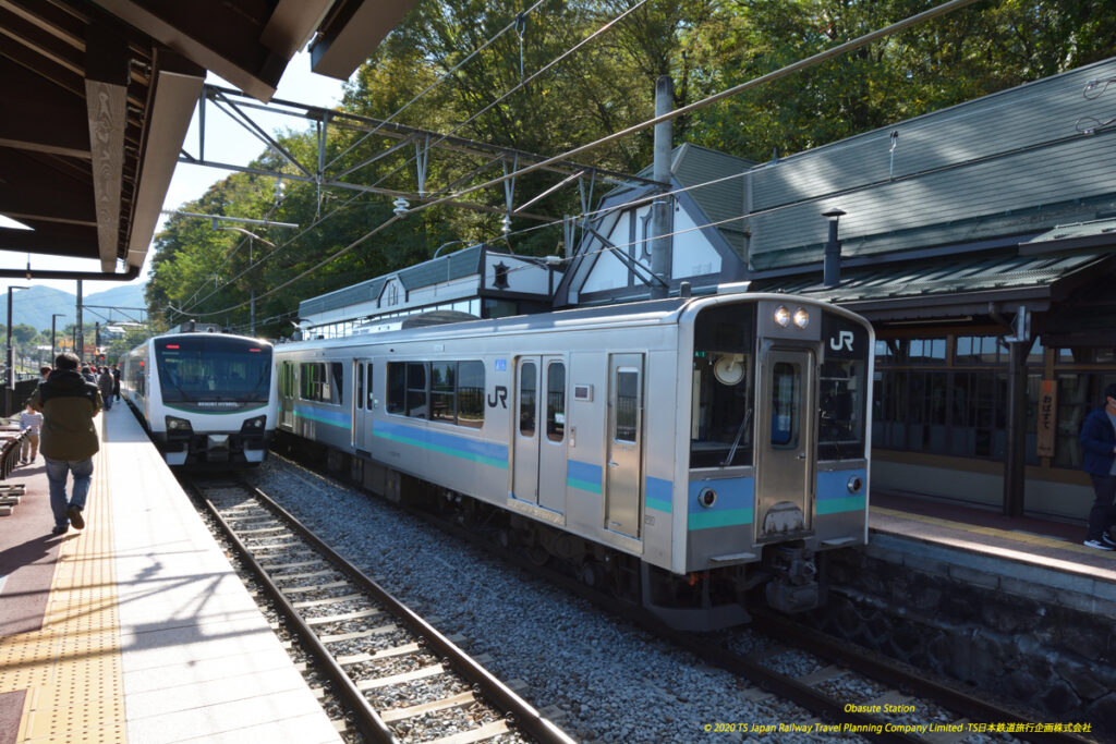 Obasute Station. An E127 EMU has just arrived whilst the resort View Furusato waits for passengers admiring the view.